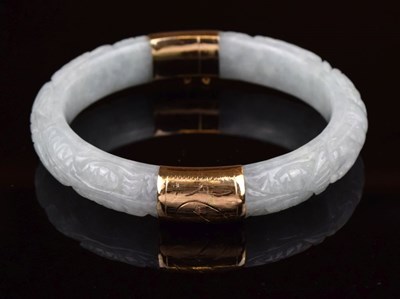 Lot 68 - Carved jade hinged bangle