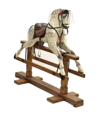 Lot 371 - Early 20th century painted dapple rocking horse on a trestle stand