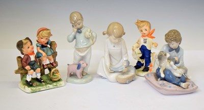 Lot 434 - Lladro figure with dog, two Nao figures, two Hummel figures