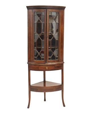 Lot 592 - George III inlaid mahogany bowfront corner cabinet