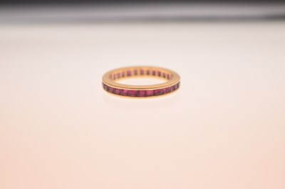 Lot 13 - 18ct gold and ruby full eternity ring