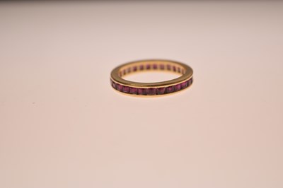 Lot 13 - 18ct gold and ruby full eternity ring
