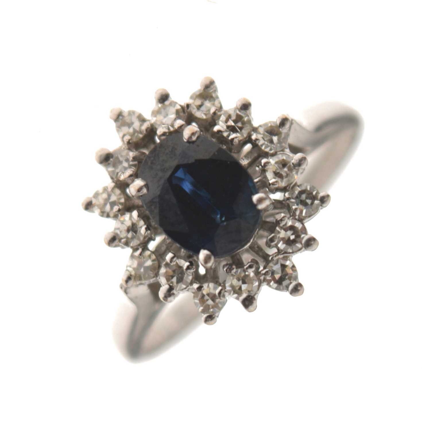 Lot 8 - Sapphire and diamond 18ct white gold cluster ring