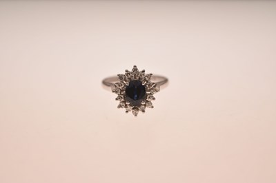 Lot 8 - Sapphire and diamond 18ct white gold cluster ring