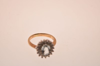 Lot 9 - Aquamarine and diamond 18ct gold cluster ring