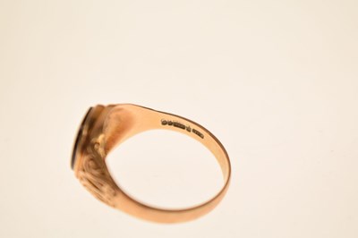 Lot 24 - Two 9ct and black onyx rings together with a similar yellow metal example