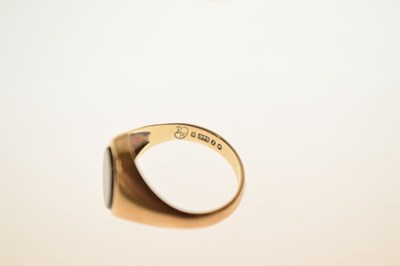 Lot 24 - Two 9ct and black onyx rings together with a similar yellow metal example