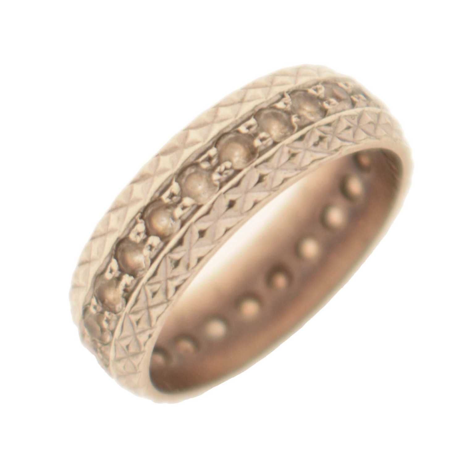 Lot 48 - White metal eternity ring