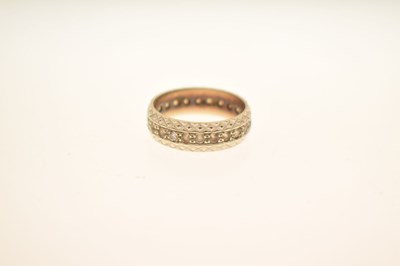 Lot 48 - White metal eternity ring