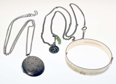 Lot 154 - Silver snap bangle, silver locket, etc