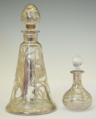 Lot 218 - Two 20th century white metal overlaid glass perfume bottles