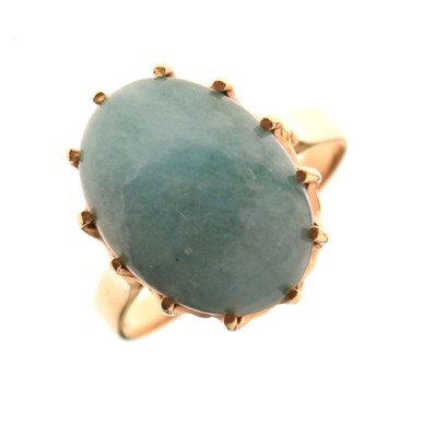 Lot 8 - Yellow metal ring set green hardstone cabochon