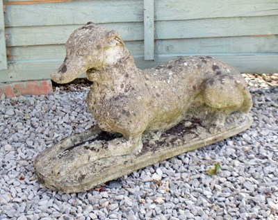 Lot 628 - Whippet / greyhound composite stone garden ornament