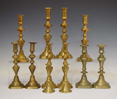 Lot 295 - Six pairs of brass candlesticks, 30cm high and smaller