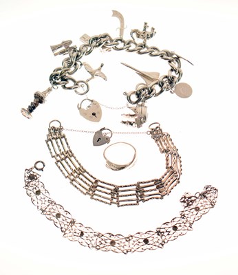 Lot 125 - Silver curb link charm bracelet, two other bracelets, and a ring (4)
