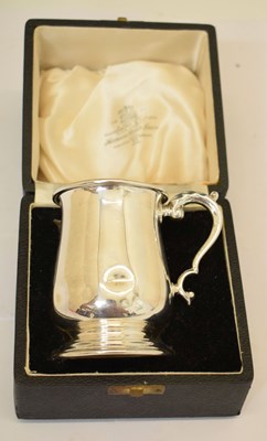Lot 203 - Elizabeth II silver christening mug with scroll handle
