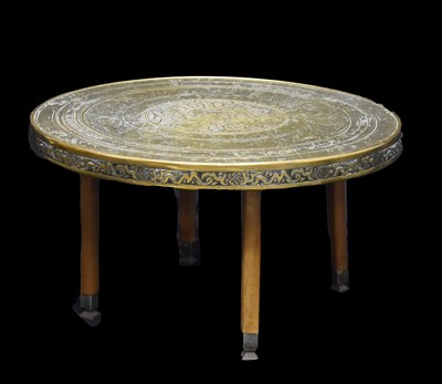 Lot 598 - 20th century Moroccan style brass top occasional table standing on four turned legs