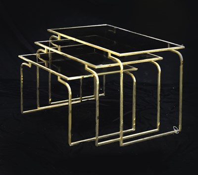 Lot 607 - Nest of three 20th century glass topped brass tables