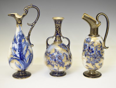 Lot 405 - Two late Victorian Doulton Burslem blue and gilt ewers plus a vase
