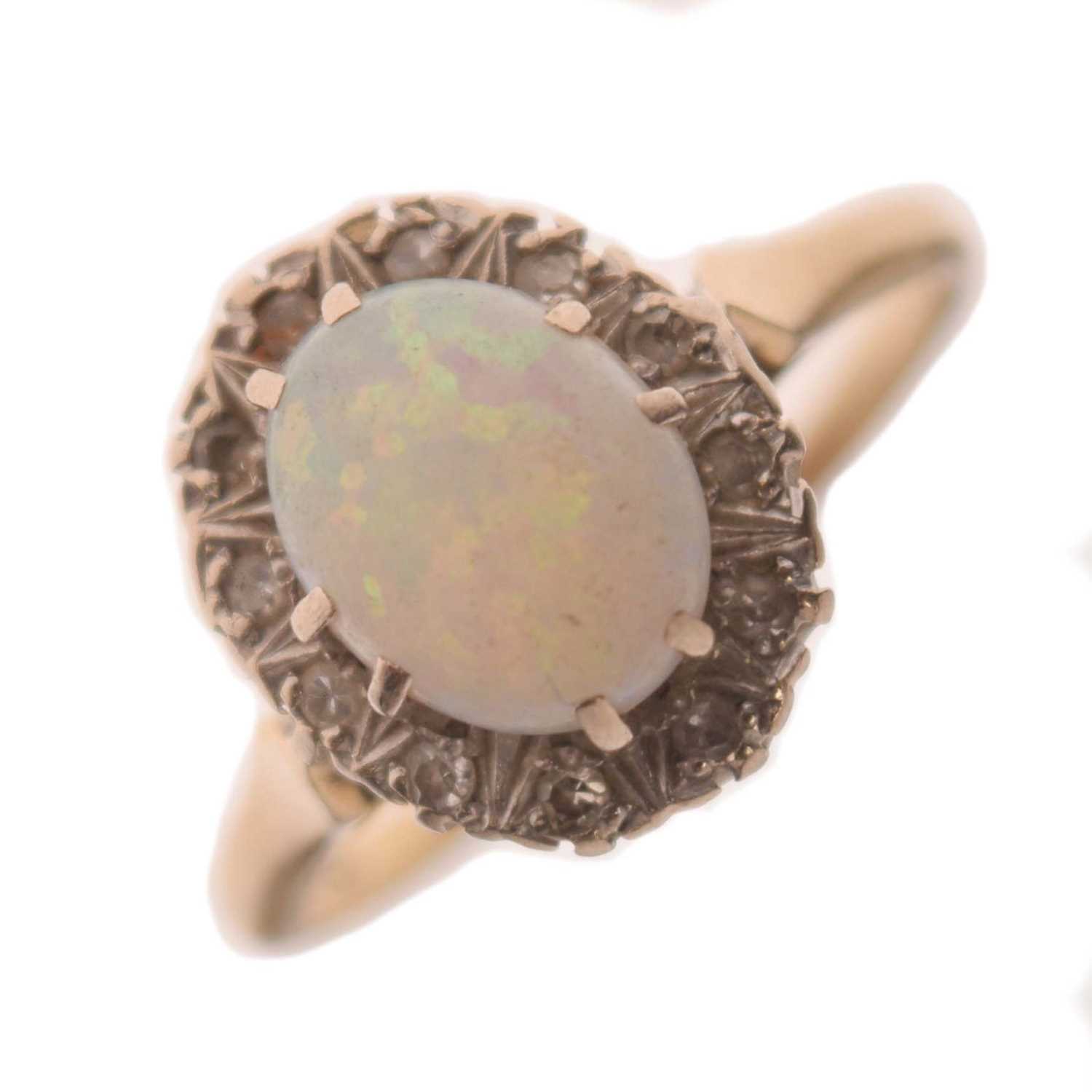 Lot 17 - Opal and diamond yellow metal ring