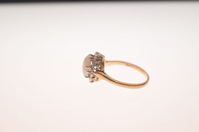 Lot 17 - Opal and diamond yellow metal ring