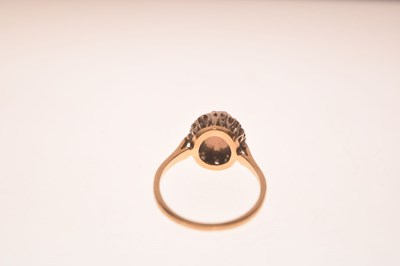 Lot 17 - Opal and diamond yellow metal ring