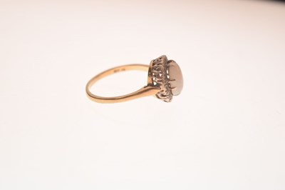 Lot 17 - Opal and diamond yellow metal ring