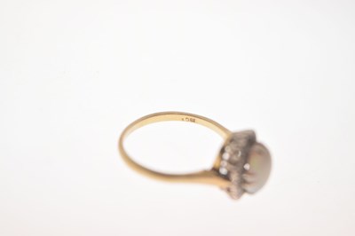 Lot 17 - Opal and diamond yellow metal ring