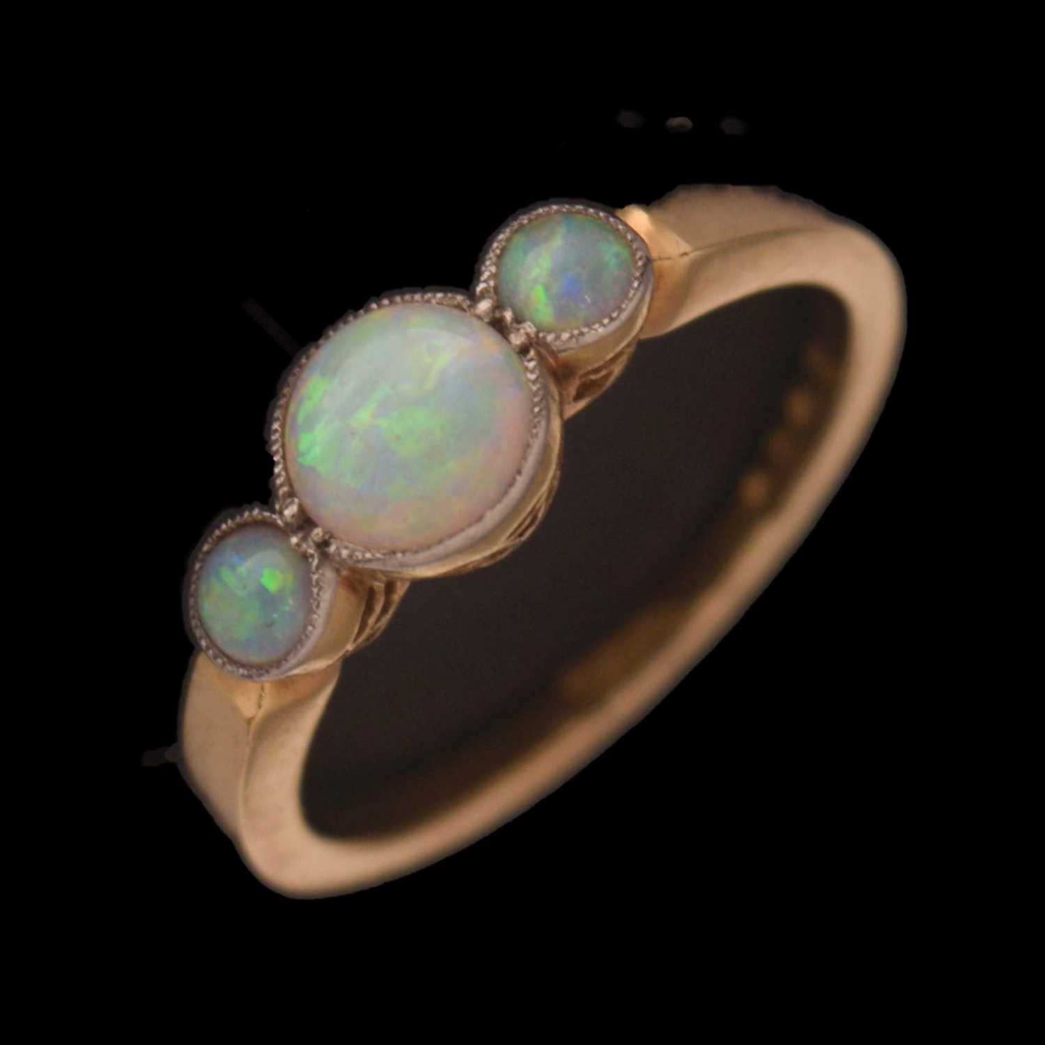 Lot 18 - Yellow metal opal three stone ring