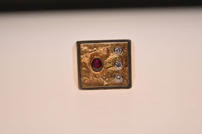 Lot 7 - Diamond and ruby yellow metal dress ring