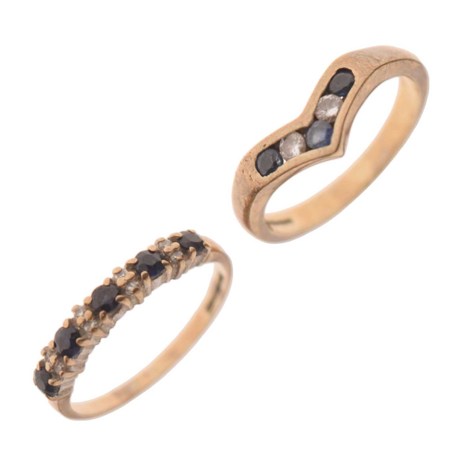 Lot 21 - Two 9ct gold sapphire and diamond / white stone rings