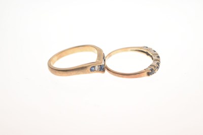 Lot 21 - Two 9ct gold sapphire and diamond / white stone rings