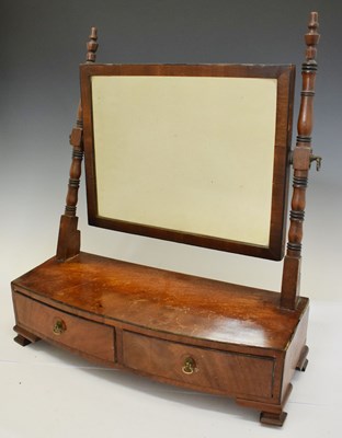 Lot 557 - Regency mahogany bowfront swing dressing / toilet mirror