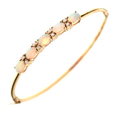 Lot 27 - Opal and diamond set hinged bangle