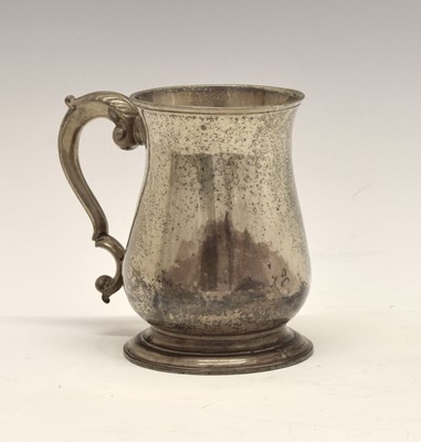 Lot 146 - George III silver mug of baluster form with leaf mounted scroll handle