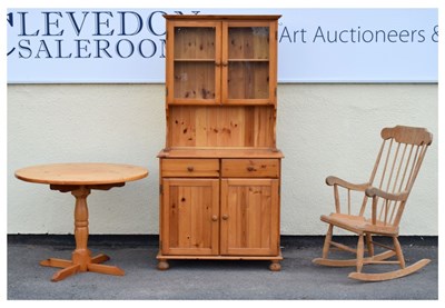Lot 654 - Pine dresser, circular table, and a rocking chair