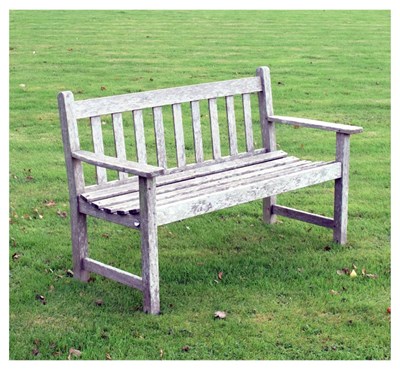 Lot 752 - Teak two seater garden bench of slatted design