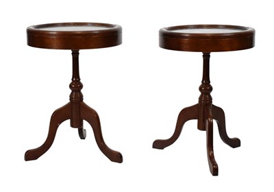 Lot 729 - Pair of circular tripod vitrine tables
