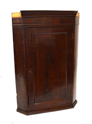 Lot 611 - George III mahogany corner cupboard