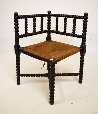 Lot 624 - Bobbin-turned rush-seated corner chair