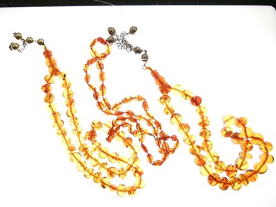 Lot 56 - Clear Amber Beads x 3