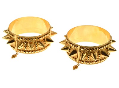 Lot 83 - Pair of Eastern hinged bangles