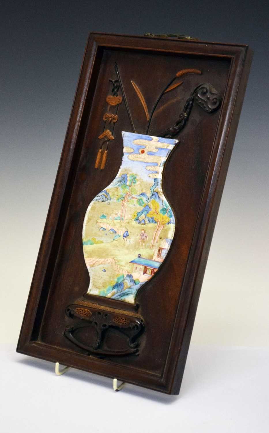 Lot 241 - Chinese hardwood and painted enamel relief panel