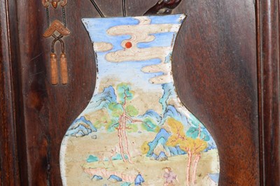 Lot 241 - Chinese hardwood and painted enamel relief panel