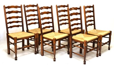 Lot 661 - Good quality rustic dining suite comprising table and six ladderback chairs