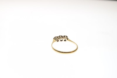 Lot 4 - '18c' yellow metal three-stone diamond ring