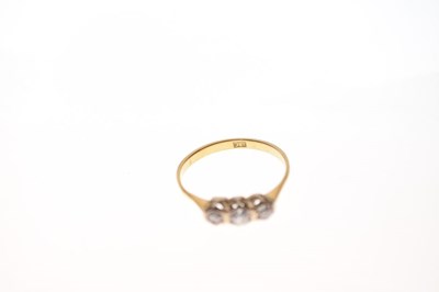 Lot 4 - '18c' yellow metal three-stone diamond ring