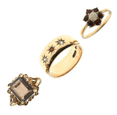 Lot 19 - Two yellow metal dress rings