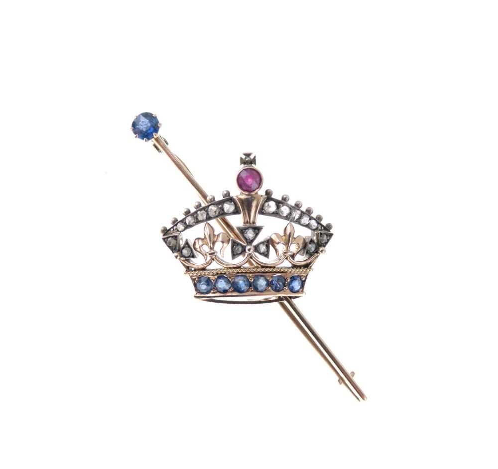 Lot 33 - Diamond, ruby and sapphire set coronet bar brooch