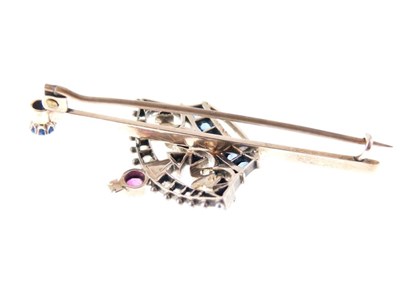 Lot 33 - Diamond, ruby and sapphire set coronet bar brooch